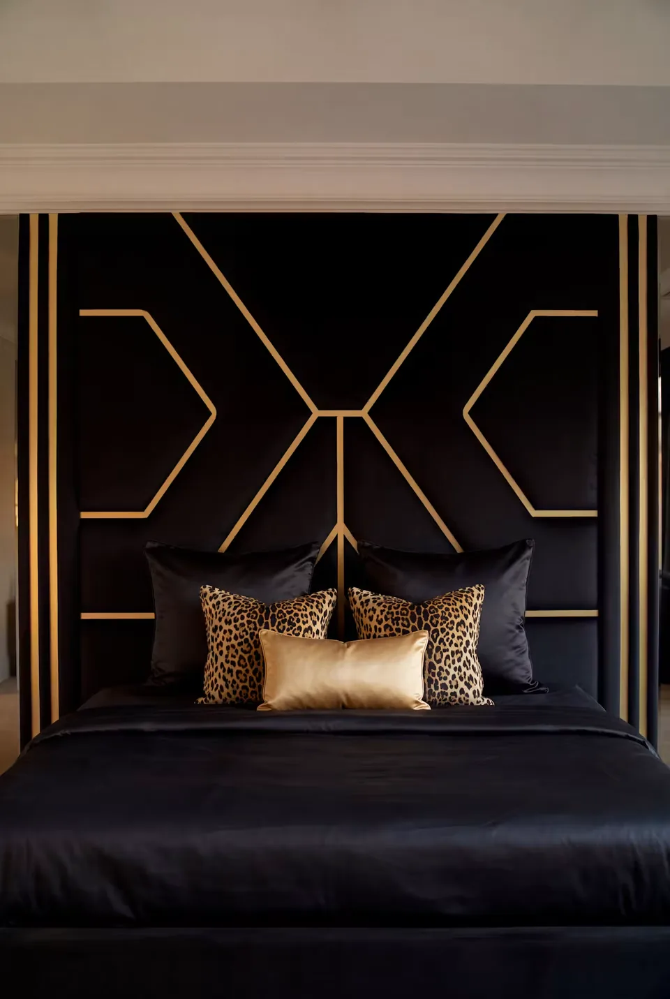 Close view of the crossing gold seams behind warm accent pillows
