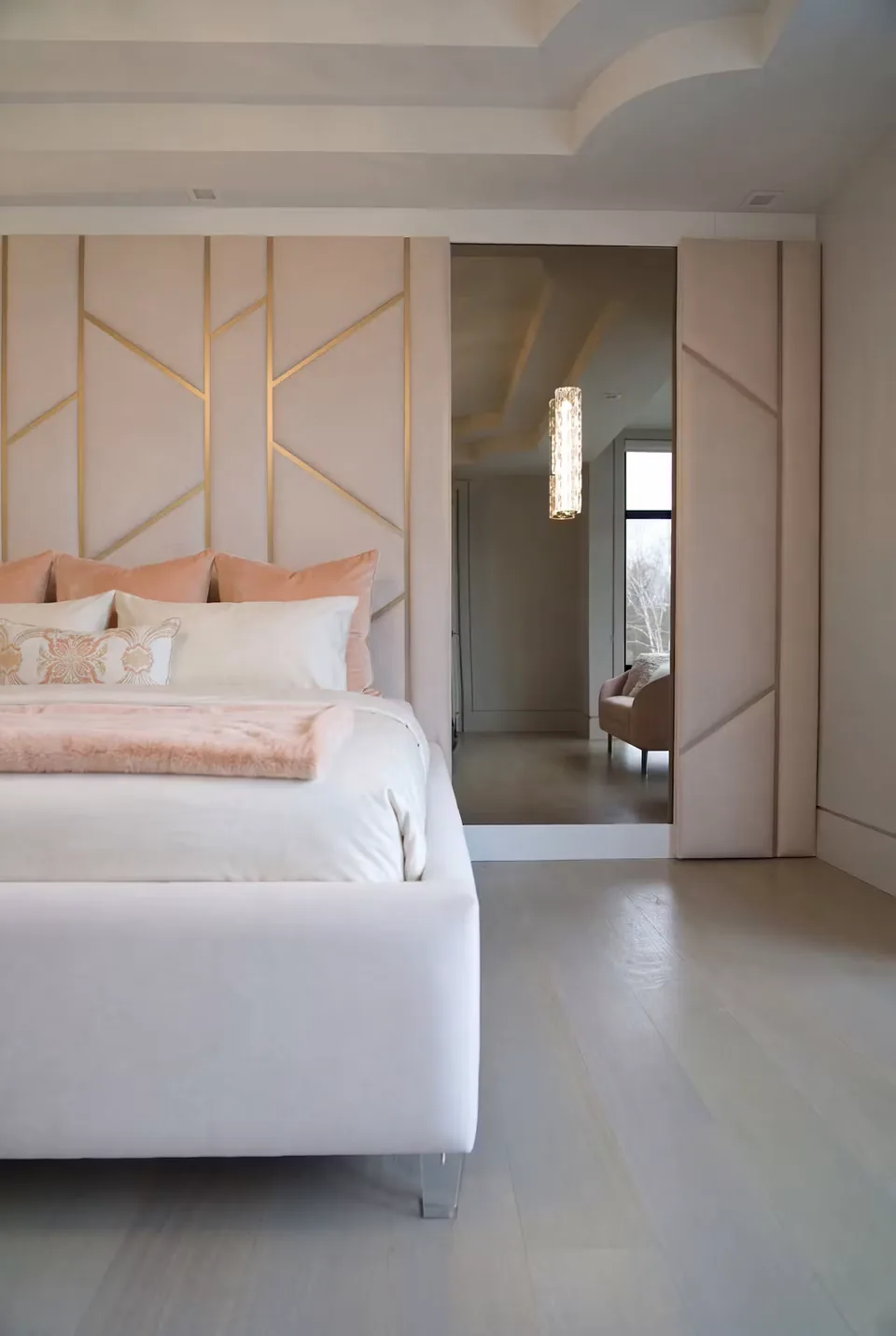 Detail of the padded wall and mirror beside the bed