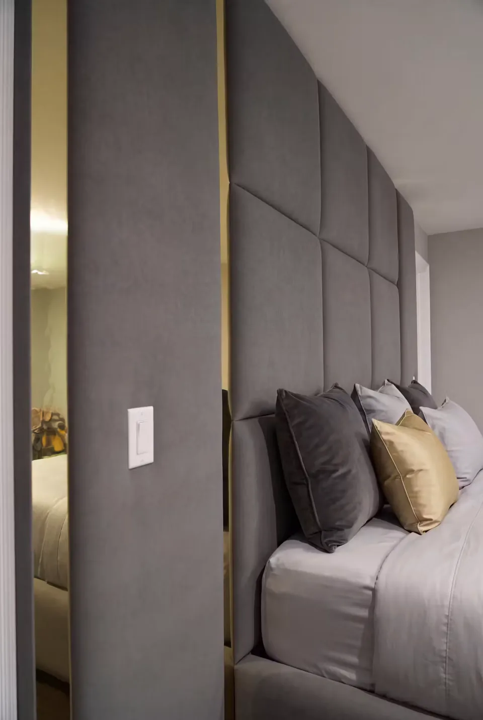 Side view of the broad padded rectangles behind the pillows