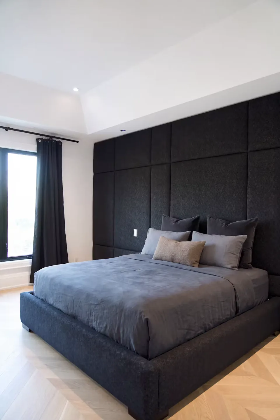 Full angled view of the charcoal bed on the pale patterned floor