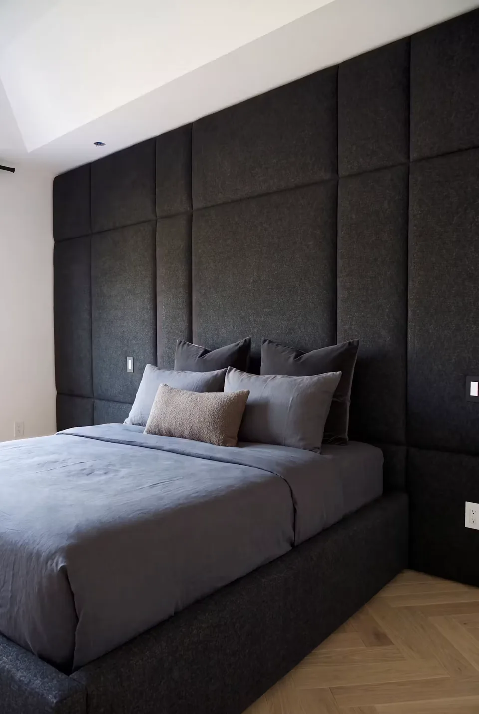Closer angled view of the dark frame and large square wall panels