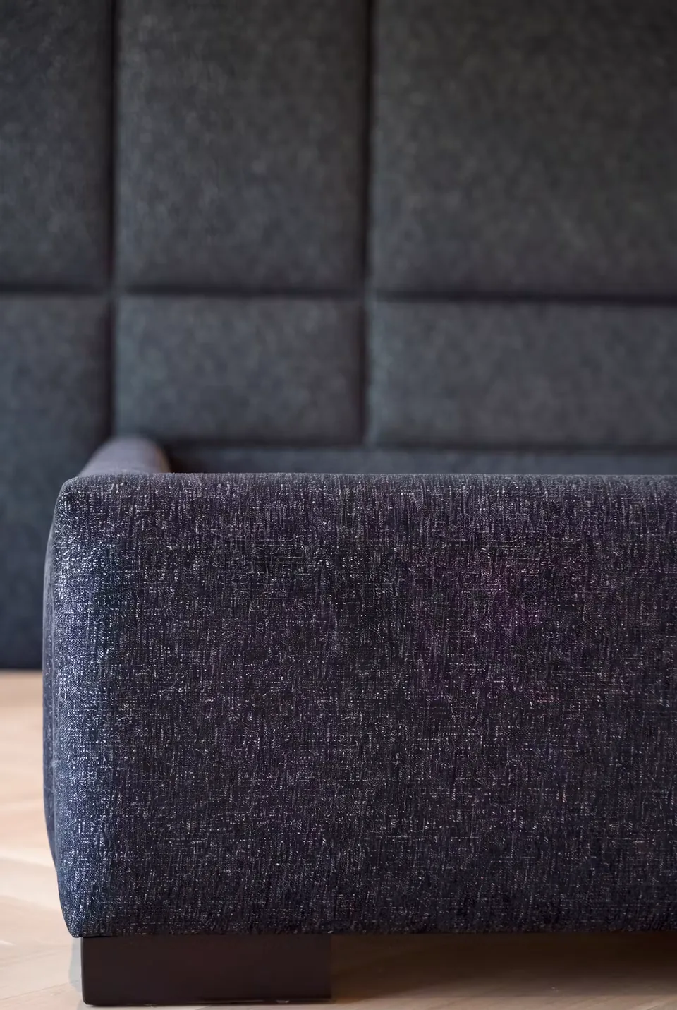 Close view of the dark upholstery at the frame corner