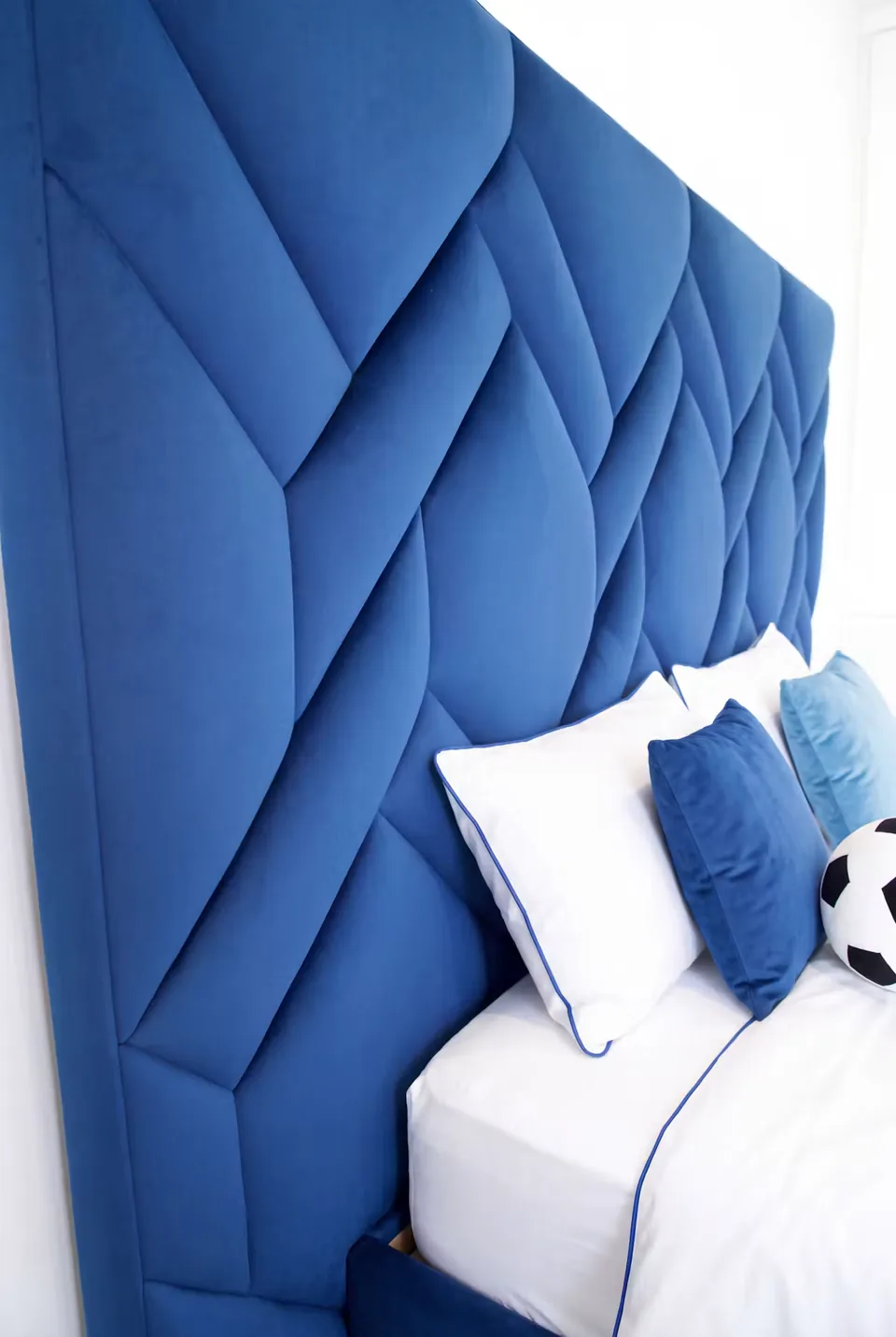 Close view of the cobalt interlocking padded headboard
