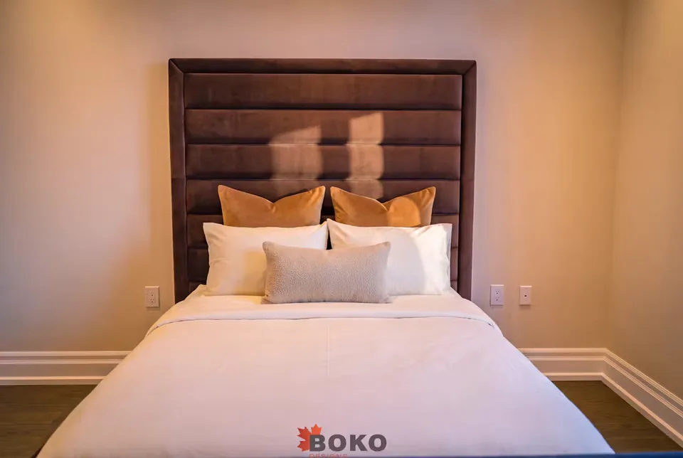 Front detail of the cocoa horizontal headboard above white bedding