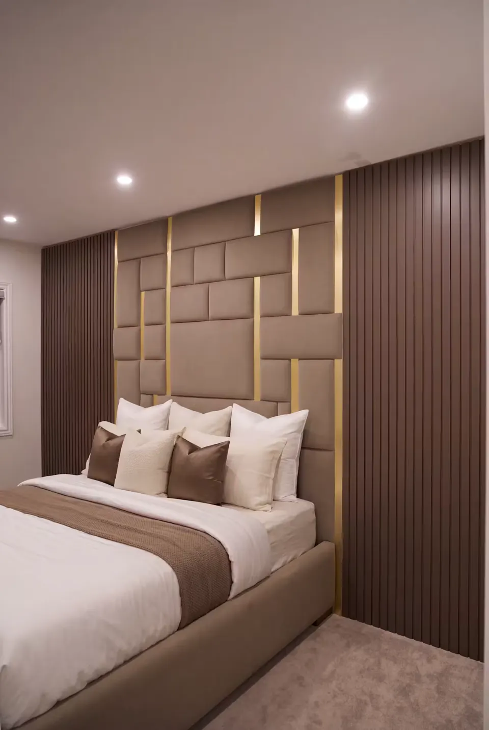 Angled view of the cocoa panel wall and neutral bedding beside dark slats.
