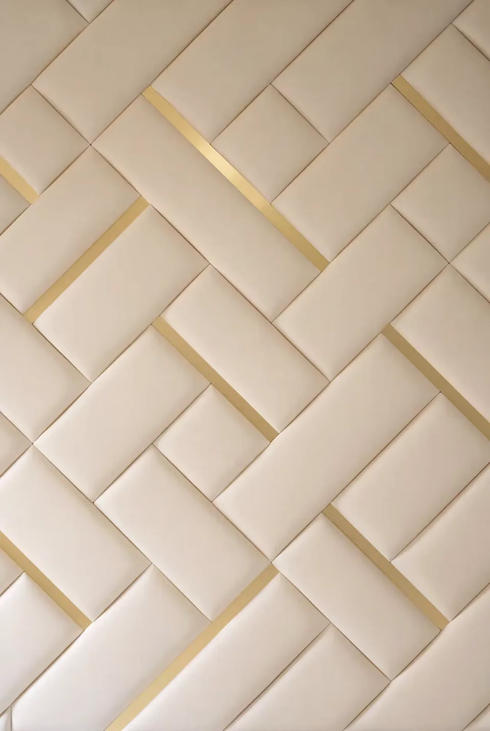 Detail of intersecting cream upholstered strips and narrow gold lines in the headboard.
