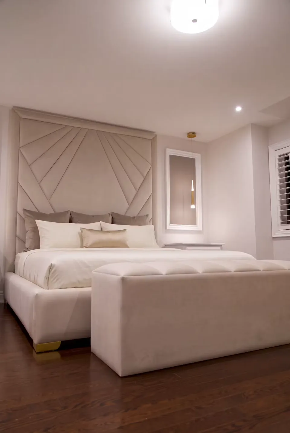 Closer view of the cream bench and radiating headboard