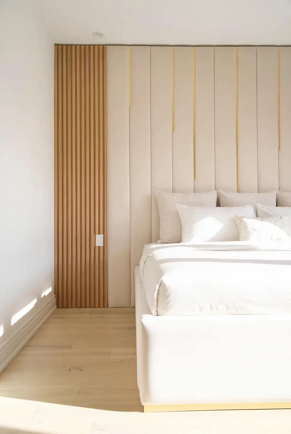 Angled view of the pale frame beside the warm vertical wall slats