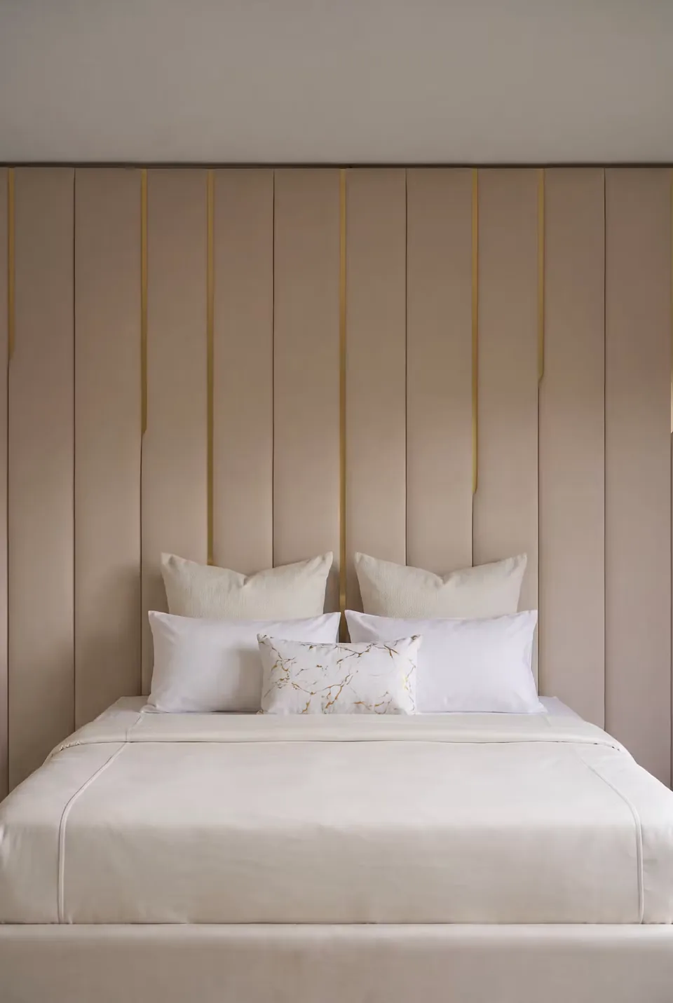 Front detail of cream padded channels and fine gold-toned lines