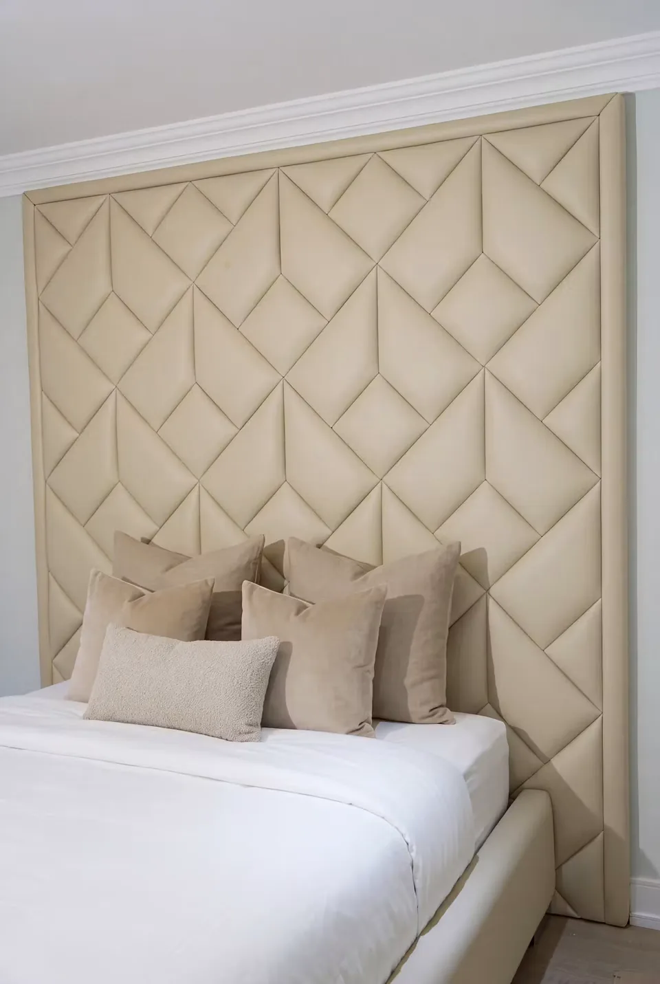 Close view of the cream diagonal seams behind the pillows
