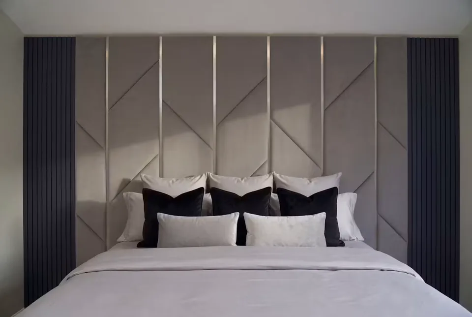 Front view of the padded branch-pattern headboard wall