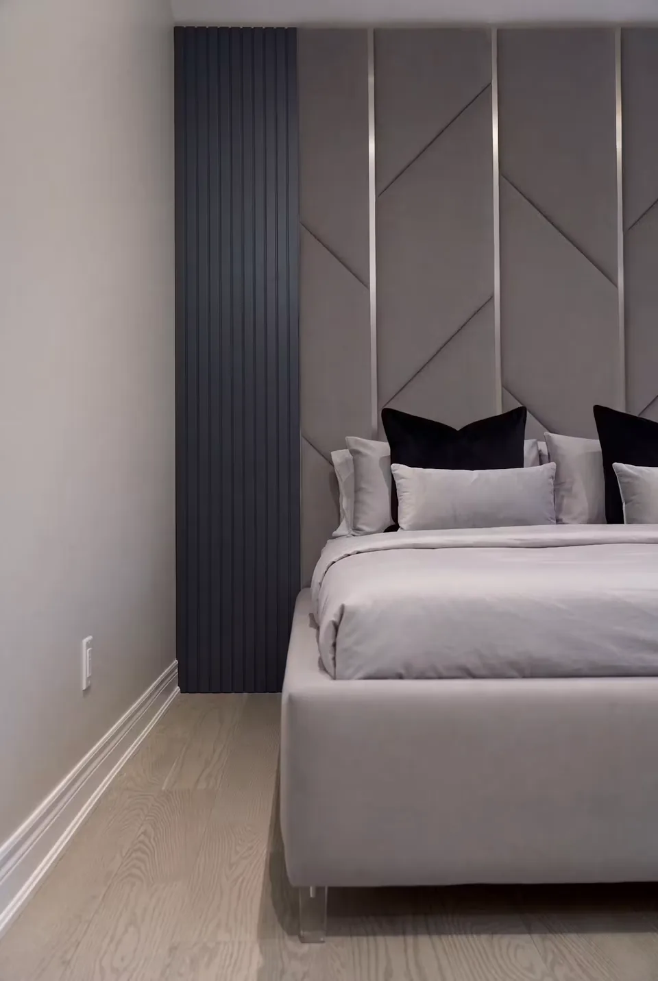 Side view of the low bed beside a dark ribbed column