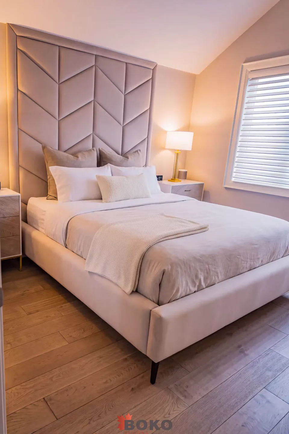 Portrait view of the greige bed and raised chevron border