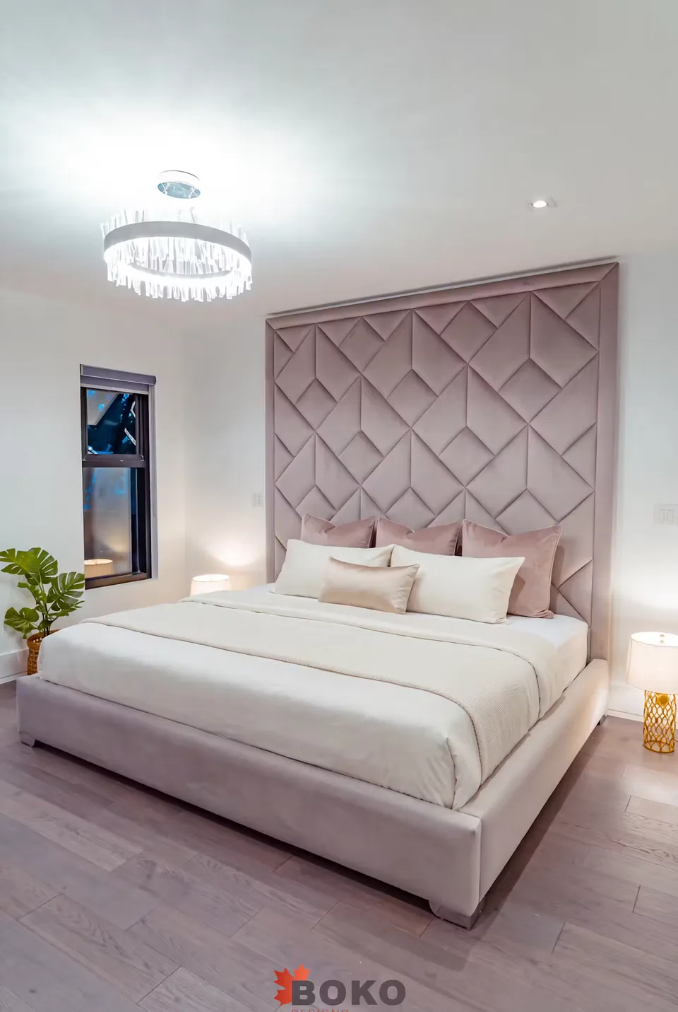 Wide corner view of the greige frame and raised headboard border