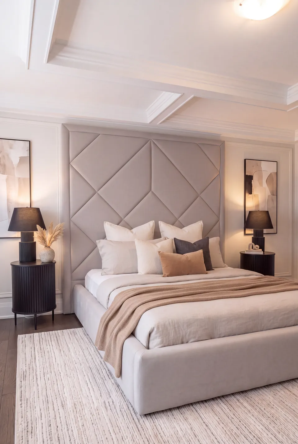 Opposite angled view of the greige frame with neutral bedding and a patterned rug.