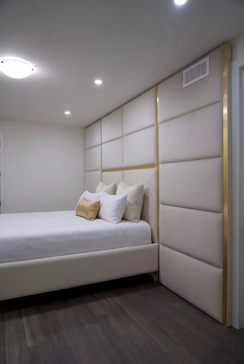 Side view of the full-height greige grid beside the bed