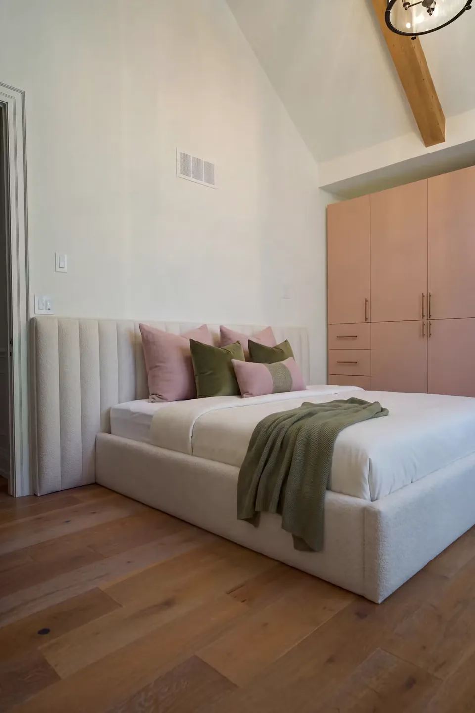 Portrait view of the ivory bed beneath the low channelled wall