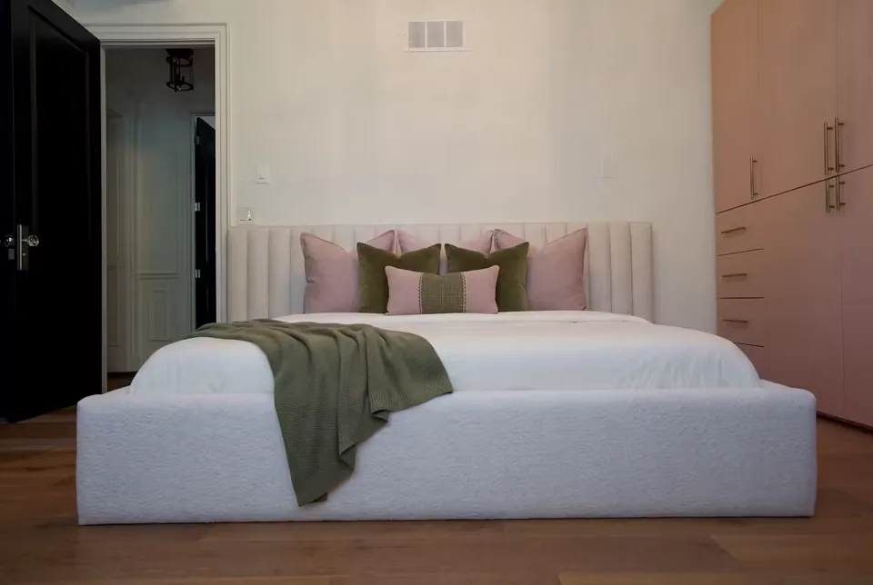 Wide front view of the ivory frame beside the blush cabinetry