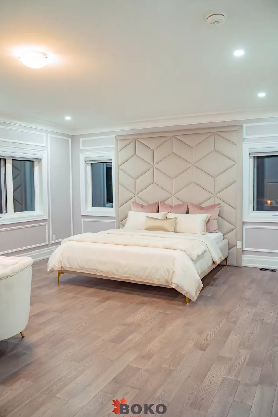 Full room view of the ivory bed and stacked diamond headboard