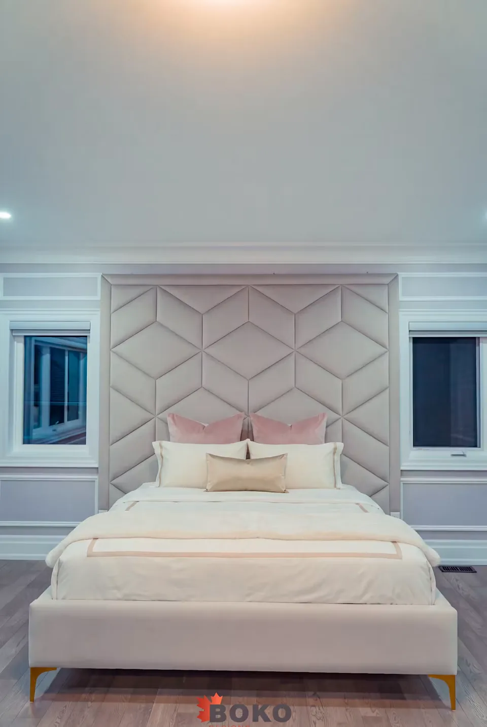 Front view of the ivory padded frame beneath the geometric panels