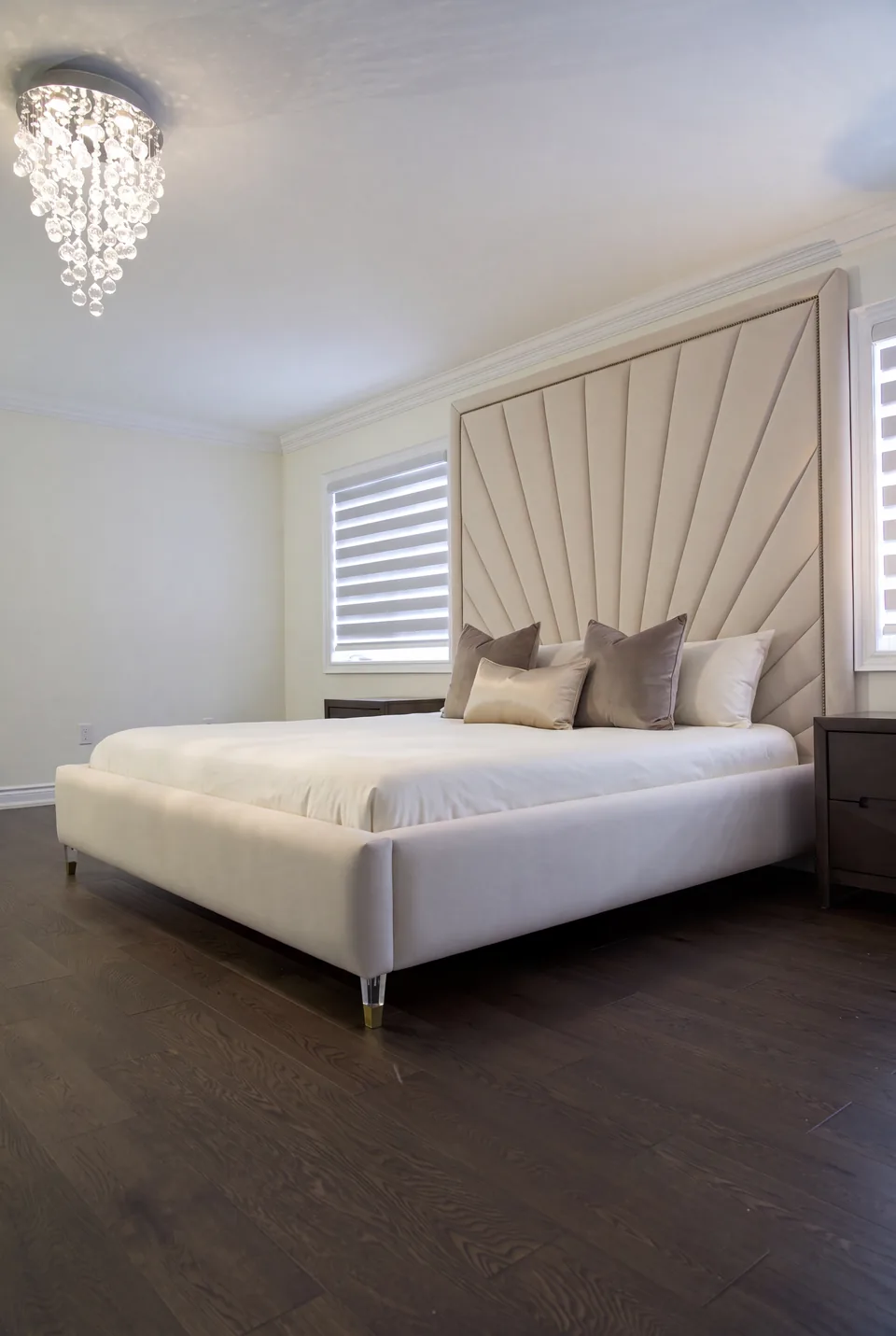 Angled view of the ivory frame and radiating bordered headboard