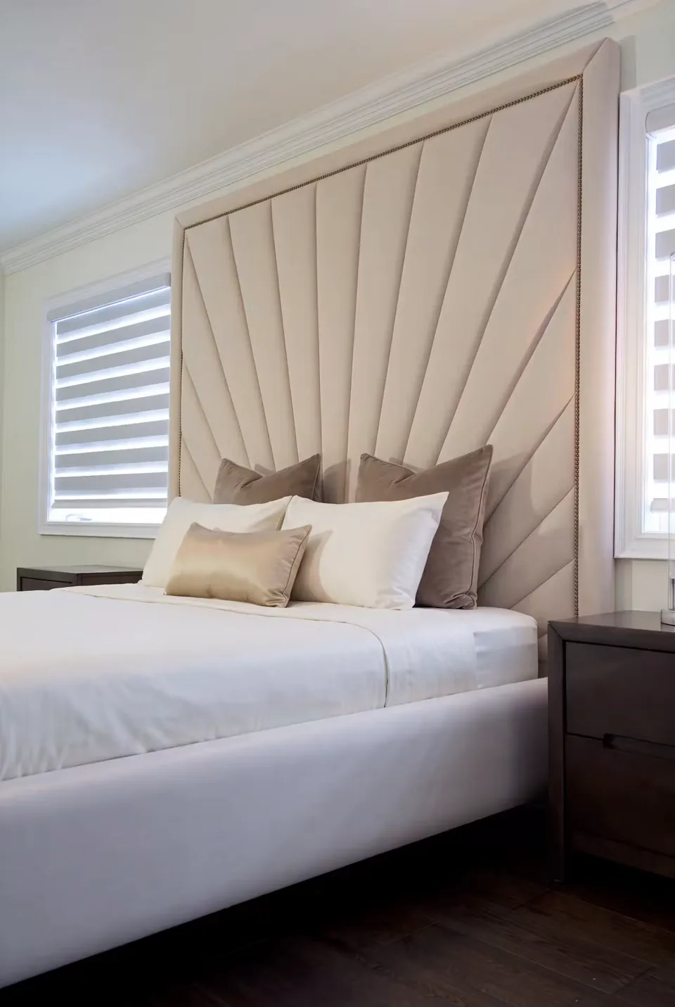 Close view of the ivory fan panels behind the pillows