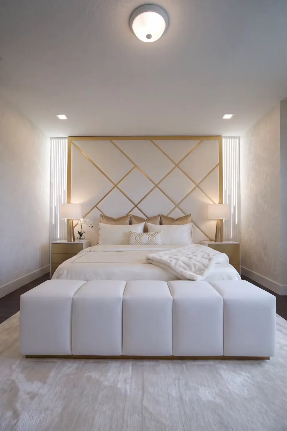 Full front view of the ivory bed and channelled footboard