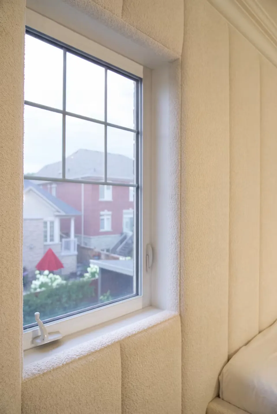 Detail of the ivory upholstery around the window opening