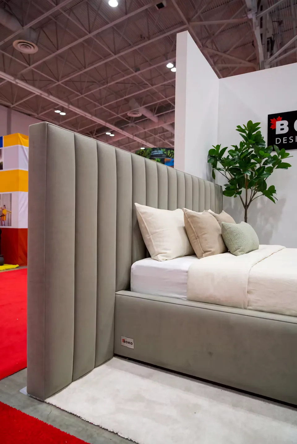 Max queen bed in dark sage green with a tall vertical channel headboard that extends past the frame