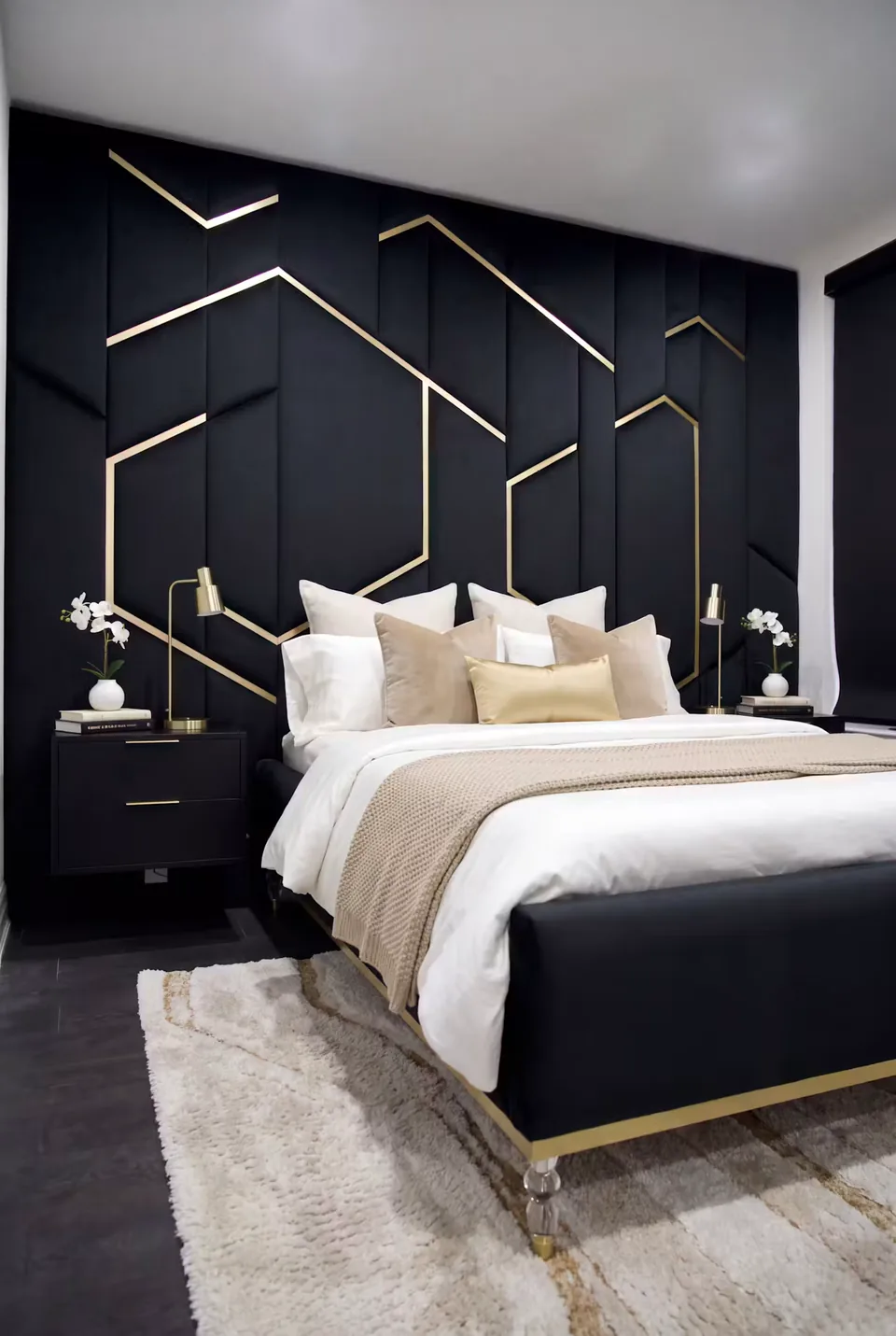 Dark upholstered bed against a dark geometric wall crossed by fine gold-toned lines