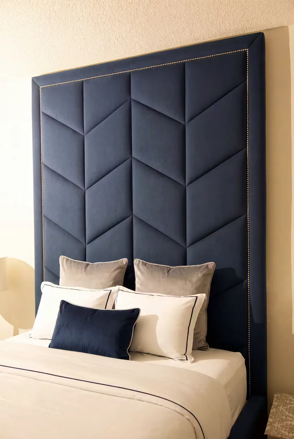 Headboard view showing the navy chevrons and raised border