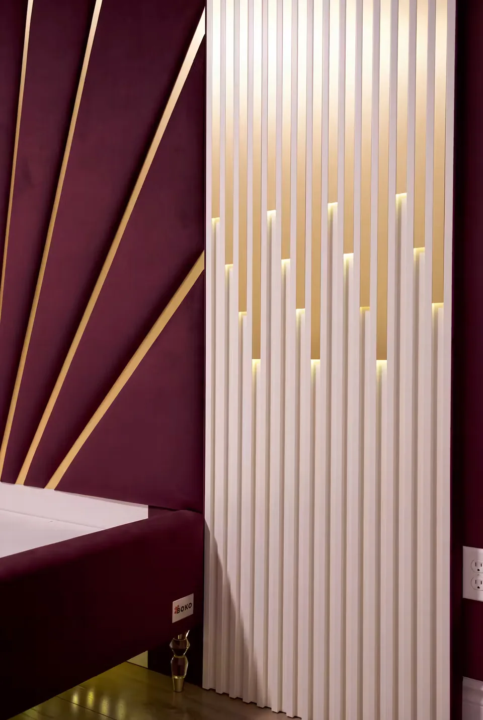 Side detail where gold rays meet the narrow ribbed upholstery