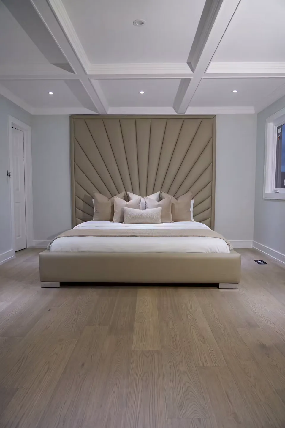 Full room view of the sand bed beneath the framed fan wall