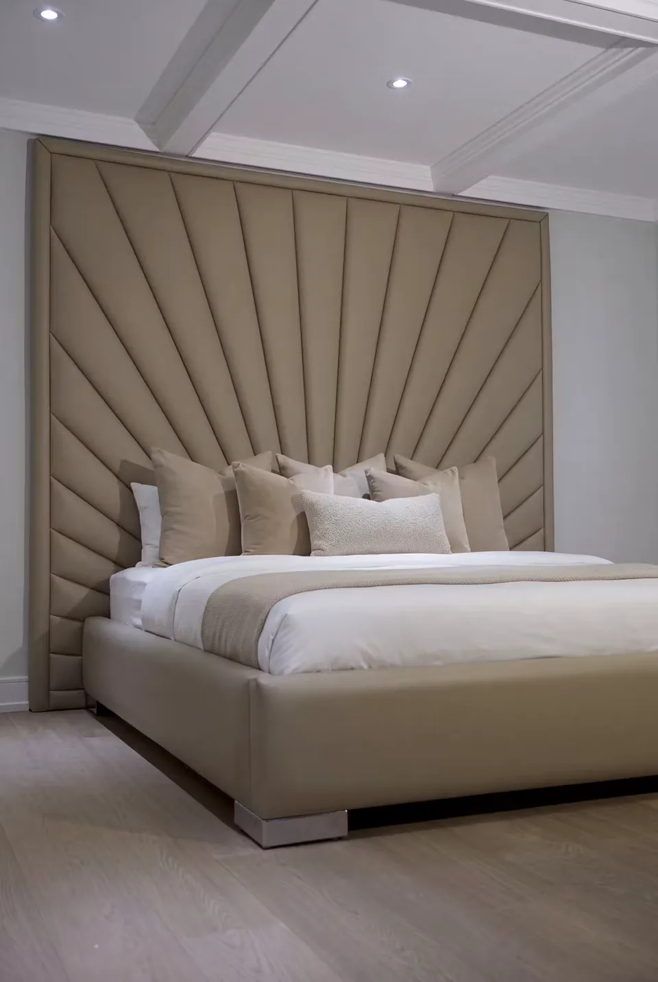 Angled view of the sand headboard and matching low frame