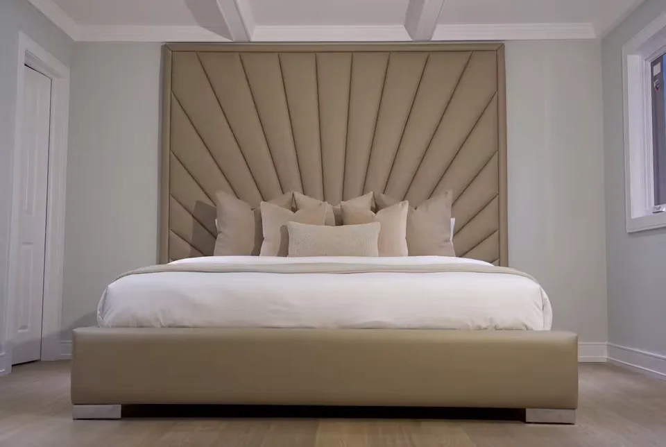 Wide front view of the bed and radiating upholstered backdrop