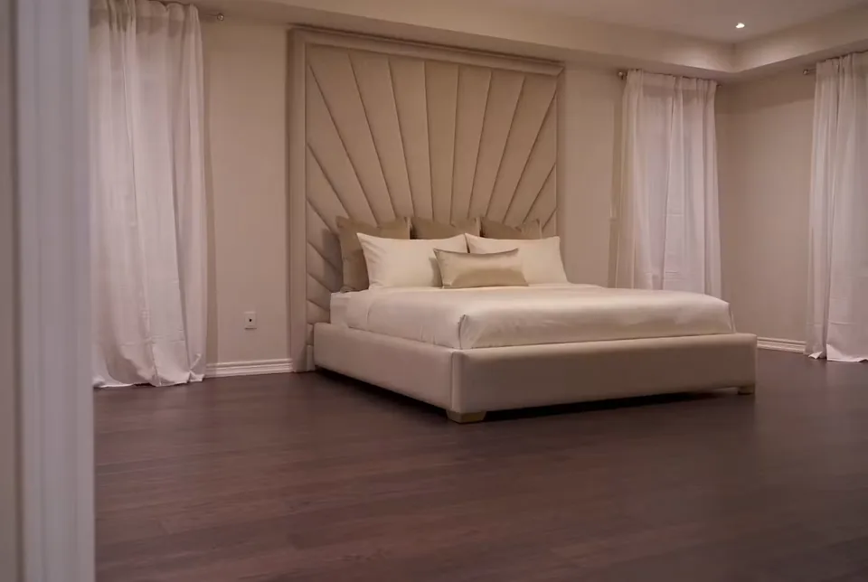 Wide room view of the sand bed and radiating headboard