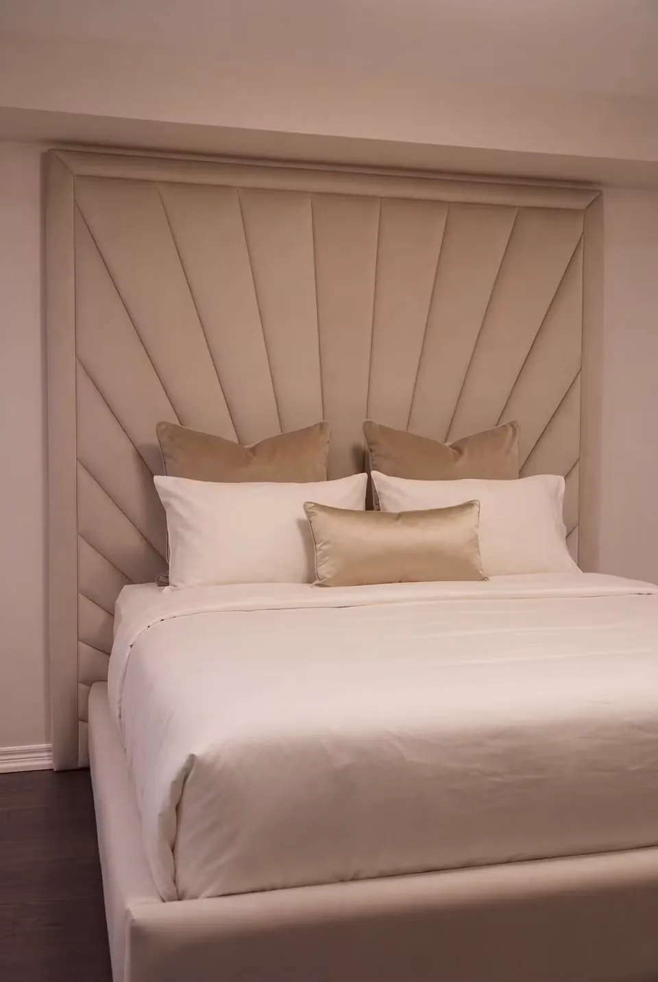 Front detail of the headboard rays behind cream pillows