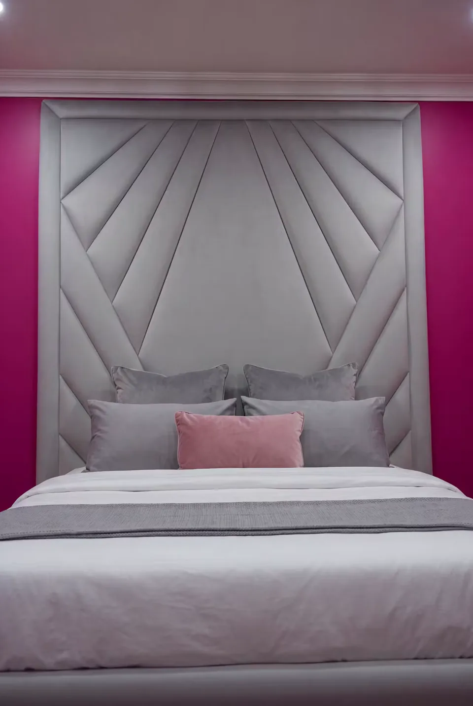 Front view of the silver fan-shaped upholstered headboard
