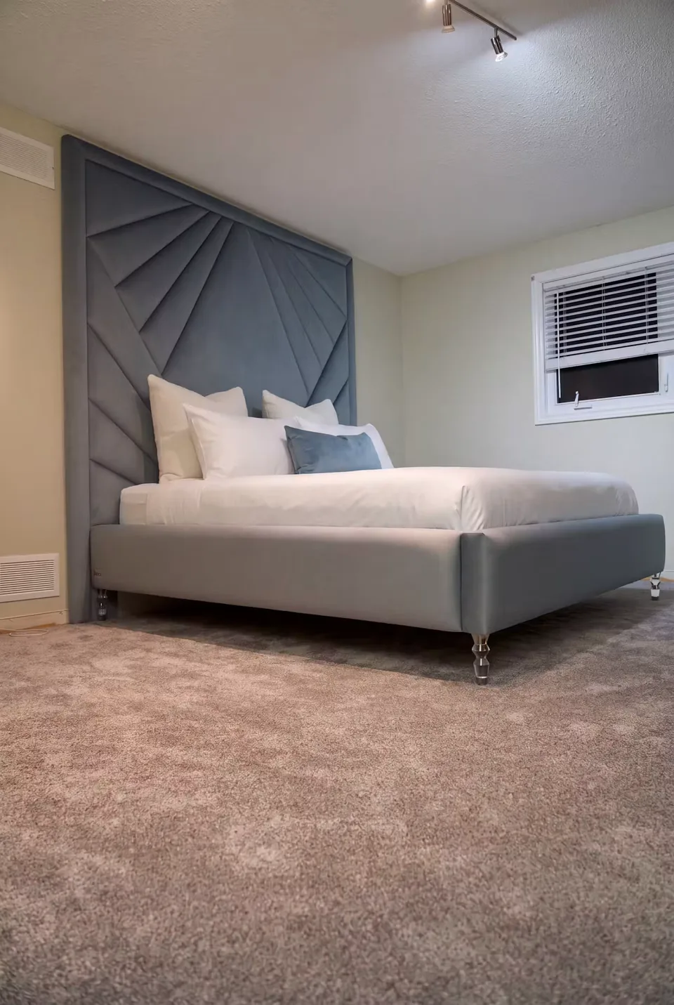 Side view of the matching blue-grey footboard and framed fan pattern