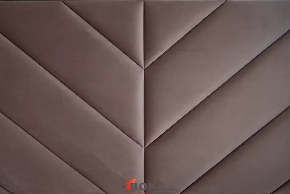 Close detail of the taupe padded diagonal seams