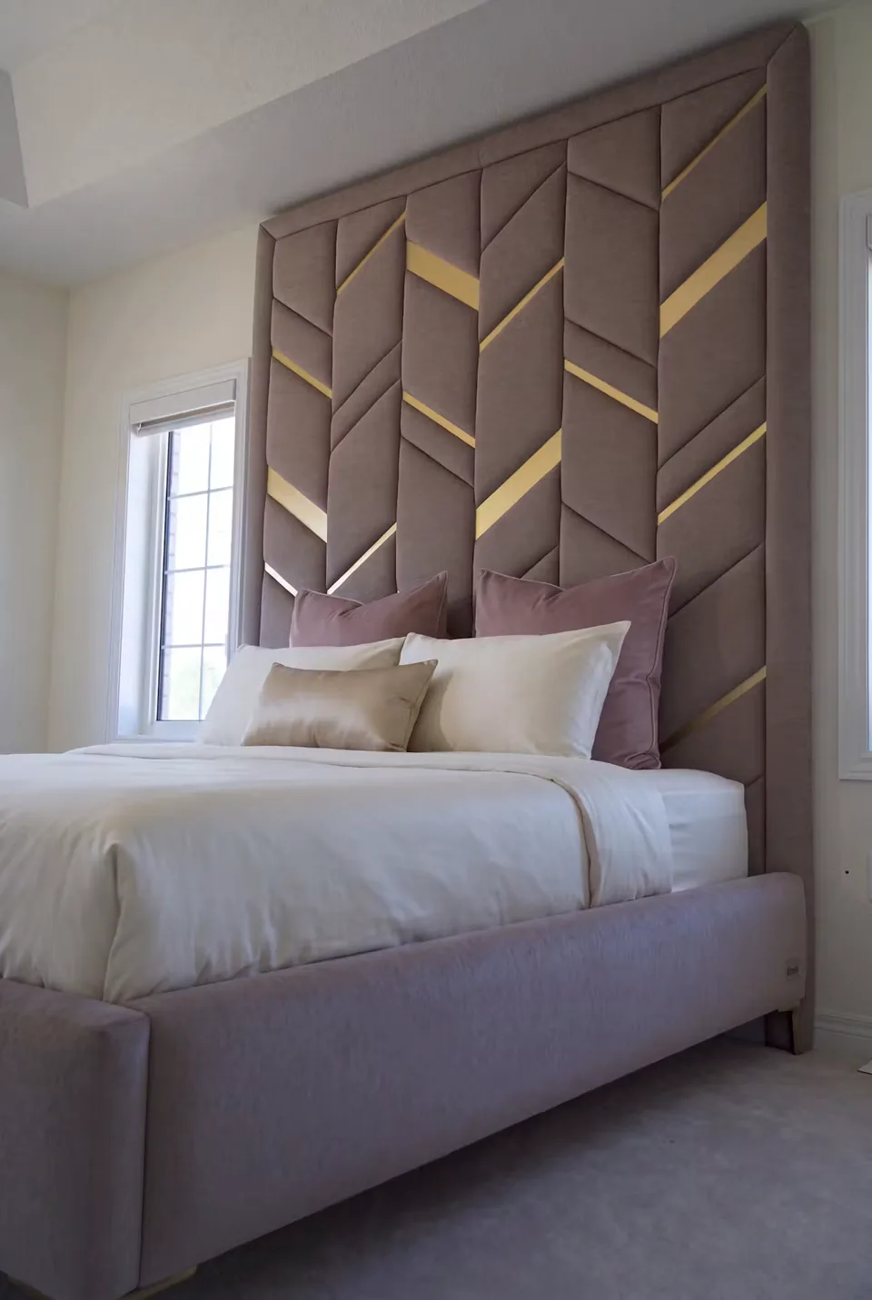 Side view of the padded chevrons and gold-toned headboard strips