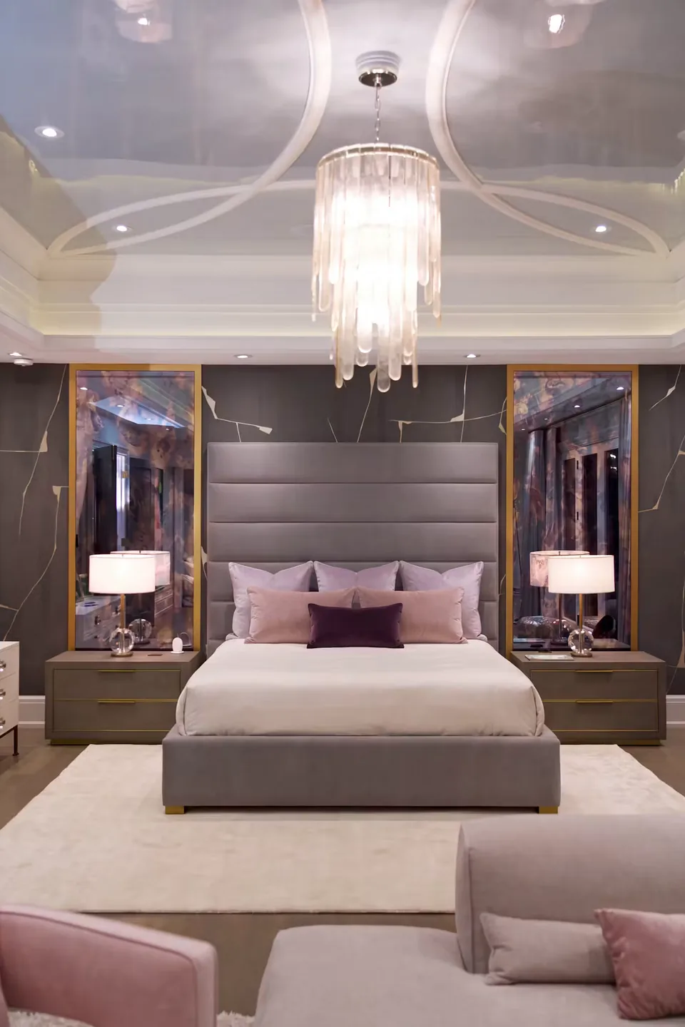 Full front view of the taupe bed between dark patterned wall panels