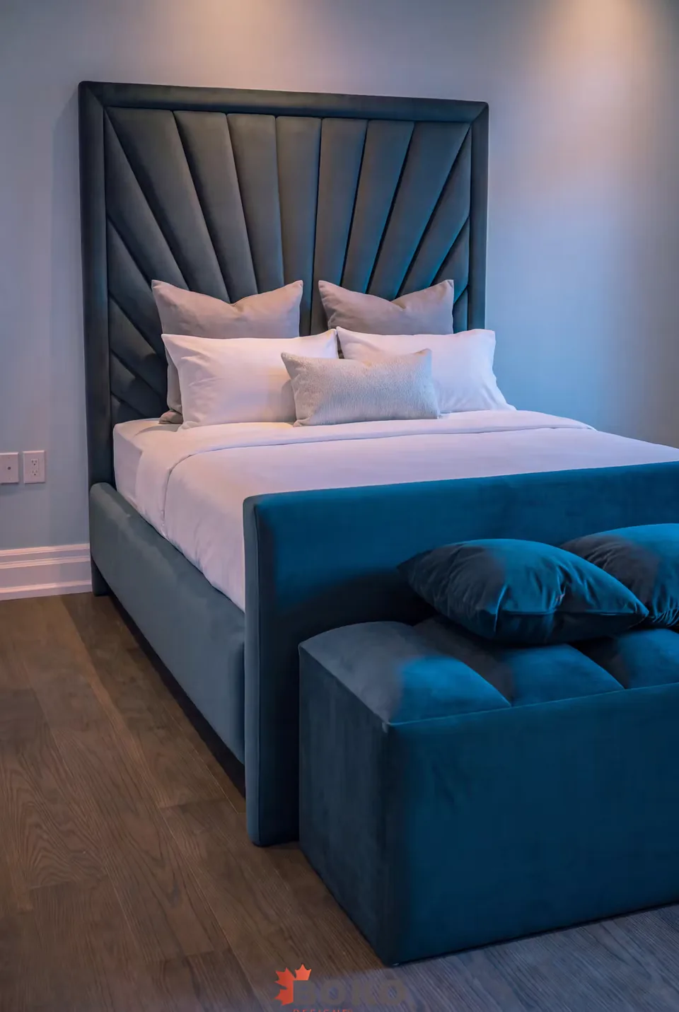 Angled view of the teal bed and matching upholstered bench